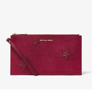 MICHAEL MICHAEL KORS
Jet Set Travel Large Star Leather Clutch
Style # 32H6GPGW3O